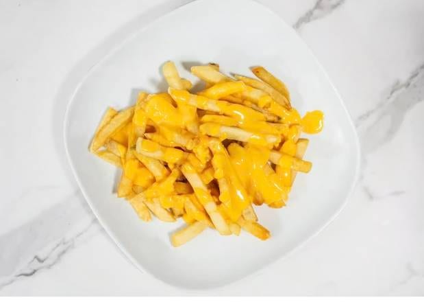 Papas Con Queso / Cheese Fries.