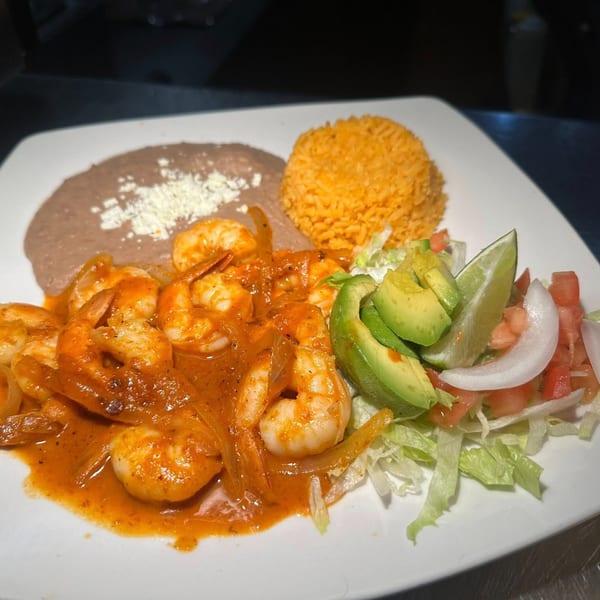 A plate of Javi Mexican Grill's camarones a la diabla with rice, refried beans, and salad.